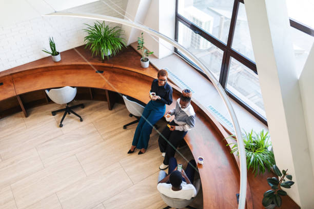 istock Colleagues having coffee break and chatting at the office 2152950751
