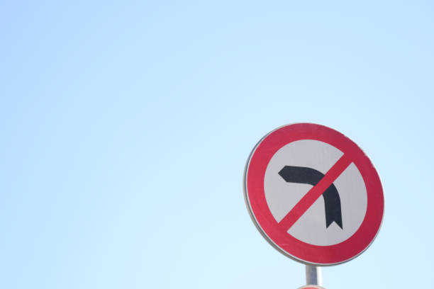 istock No Left Turn Sign traffic sign against blue sky 2152952672