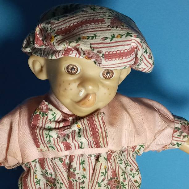 Photo of Pierrot toy doll on white background