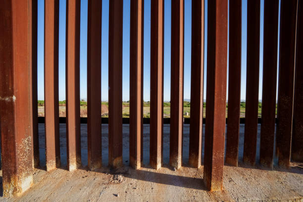istock International Border Wall at Tornillo Crossing in Texas At Dusk 2152958065