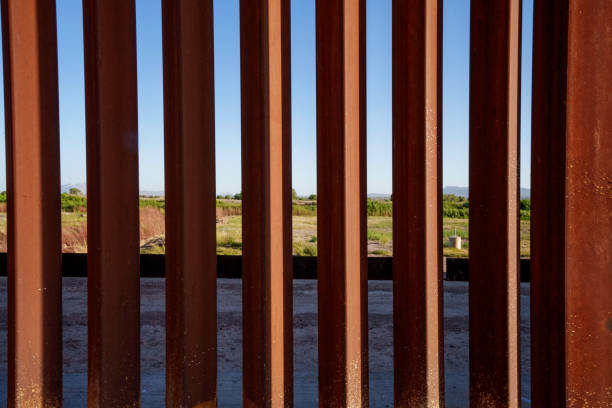 istock International Border Wall at Tornillo Crossing in Texas At Dusk 2152958244