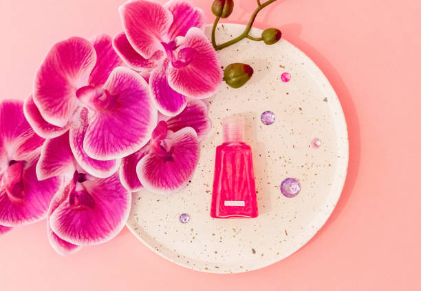 istock One small bottle of liquid soap with an orchid flower. 2152959636
