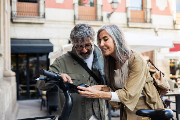 istock Mature man and woman on vacation renting e-bikes 2152959731