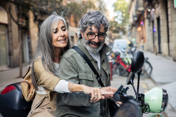 istock Mature couple on vacation riding on a motor scooter 2152959766