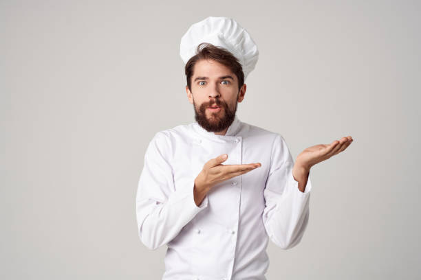 istock male cook restaurant service Professional hand gesture light background 2152959820