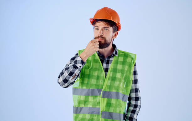 istock an architect in a helmet and a reflective vest gestures with his hands Copy Space 2152961315