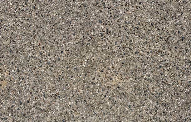 istock A pathway surfaced with crushed stone pebbles, creating a textured and durable walkway that blends harmoniously with natural surroundings. 2152961821