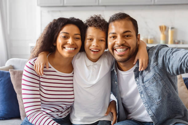 Black Family Taking a Selfie on the Couch