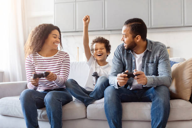 istock Cheerful Family Enjoying a Competitive Video Game Session 2152962674