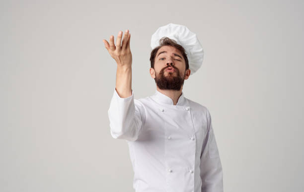 istock a chef in a light suit gesturing with his hands a professional in his field cooking model 2152962792