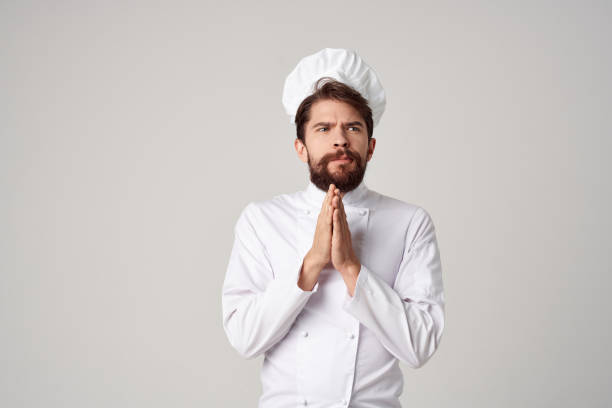istock bearded man Chef uniform Cooking emotions gourmet isolated background 2152962876