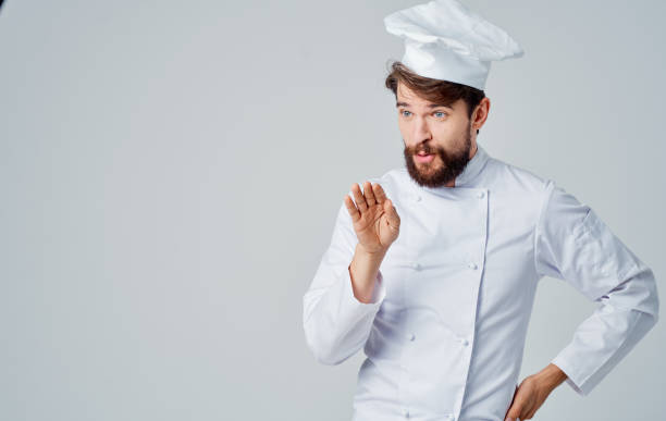 istock A man in light clothes, a chef gestures with his hands Copy Space gray background 2152963546
