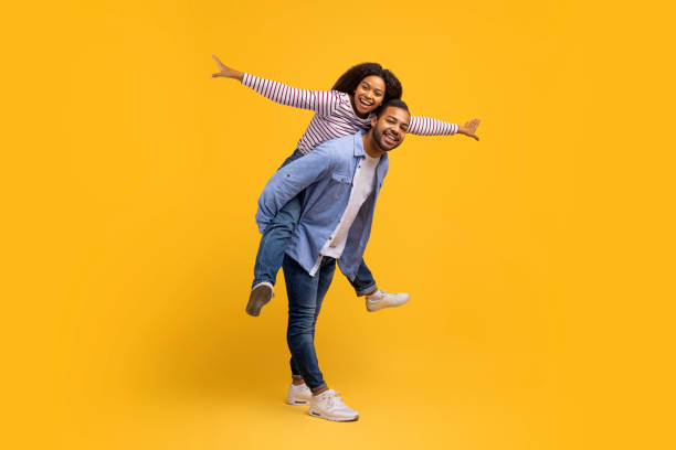 istock Loving young black couple enjoying time together, having fun in studio 2152963616