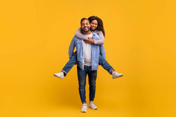 istock Romantic Young Black Man Piggybacking His Cheerful Girlfriend, Having Fun Together 2152963685