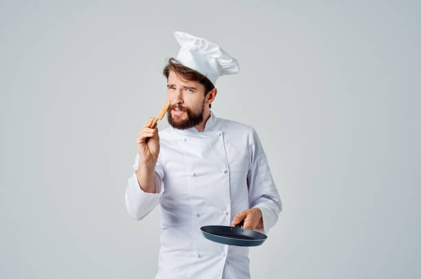 istock professional chef frying pan in hands restaurant kitchen 2152963735