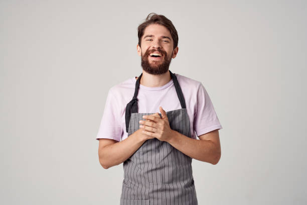 istock bearded man in apron working as a cook Professional 2152964044