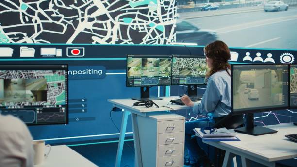 istock Monitoring room operator looking for routes on surveillance footage 2152965879