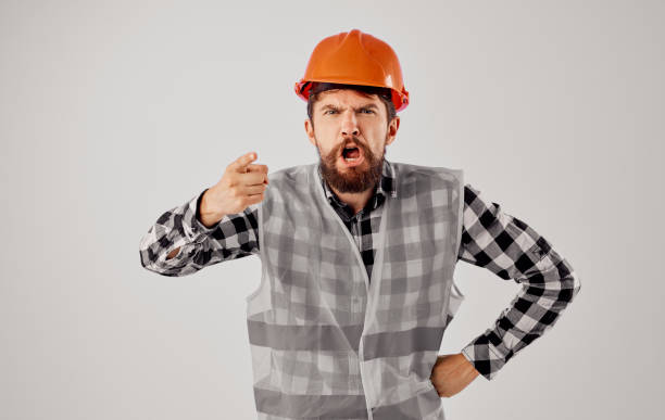istock Worker Construction uniform orange hard hat Professional cropped view 2152966378