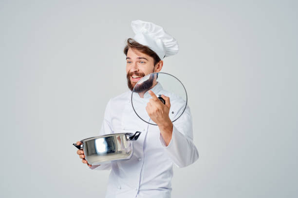 istock male chef with a cap on his head a saucepan in his hands kitchen cooking 2152966524