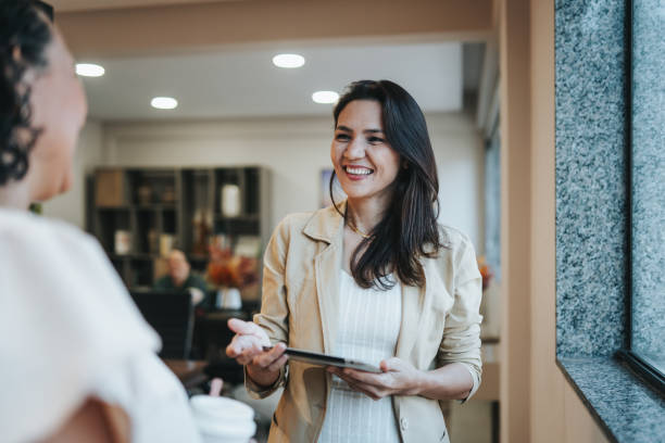 istock Smiling businesswomen interacting 2152966642