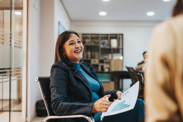 Smiling businesswomen interacting