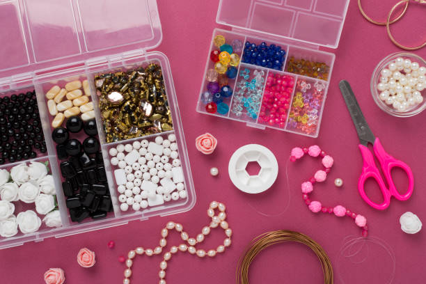 istock Tools and beads for making handmade jewelry on color background, top view 2152967168