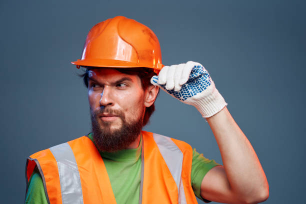 istock emotional worker construction uniform professional close-up blue background 2152967458