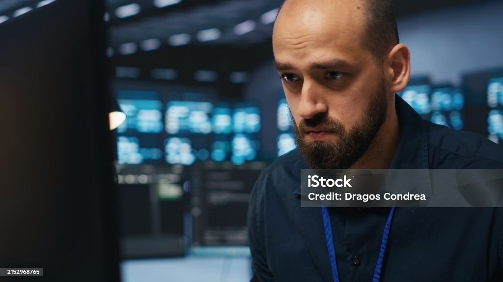 Stressed In Coding Overworked Engineer Feeling Stressed While Coding In Data Center Stock ...