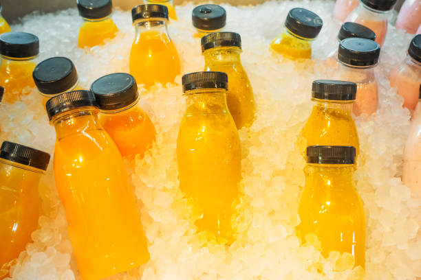 istock Healthy fresh juice in plastic bottles freeze in ice 2152969277