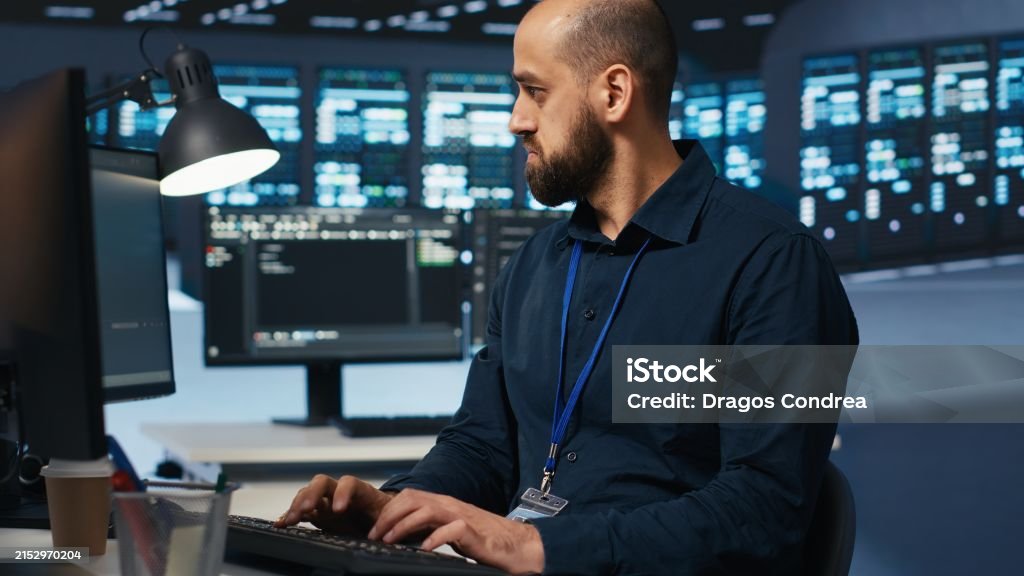 Computer Scientist Overseeing Server Hub Typing Code On Pc Stock Photo ...