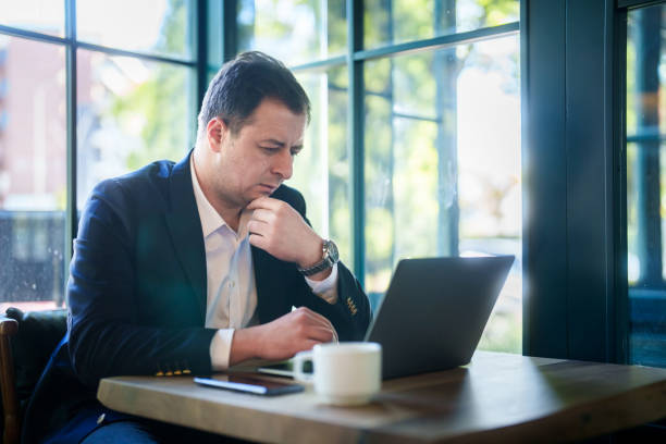 istock Businessman working with laptop and mobile phone. in cafe. 2152971333