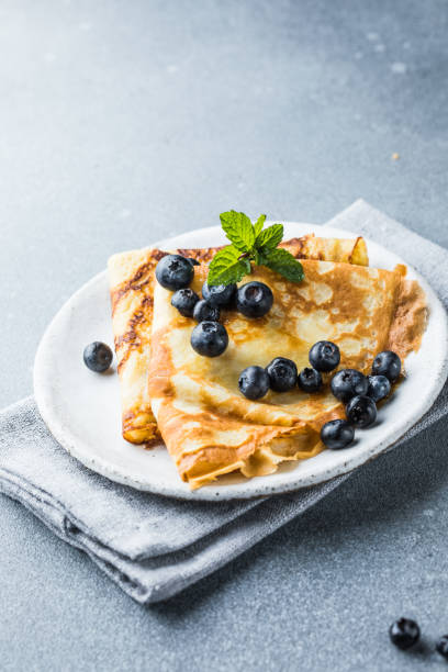 istock Stack of traditional russian pancakes blini on gray background with copy space. Homemade russian thin pancakes blini. 2152971840