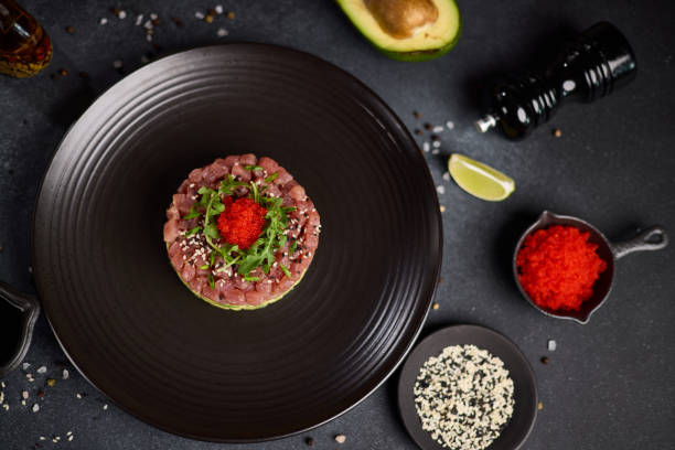 istock Tuna and avocado tartare on a dark ceramic plate 2152976975