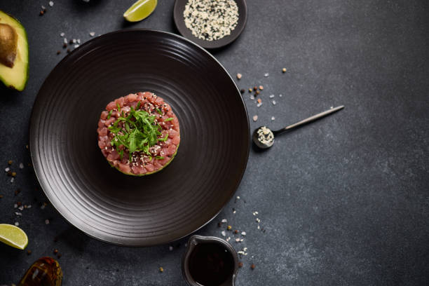 istock Tuna and avocado tartare on a dark ceramic plate 2152976976
