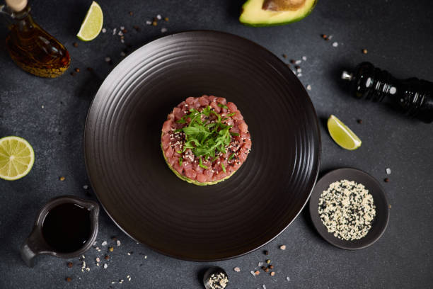 istock Tuna and avocado tartare on a dark ceramic plate 2152976977