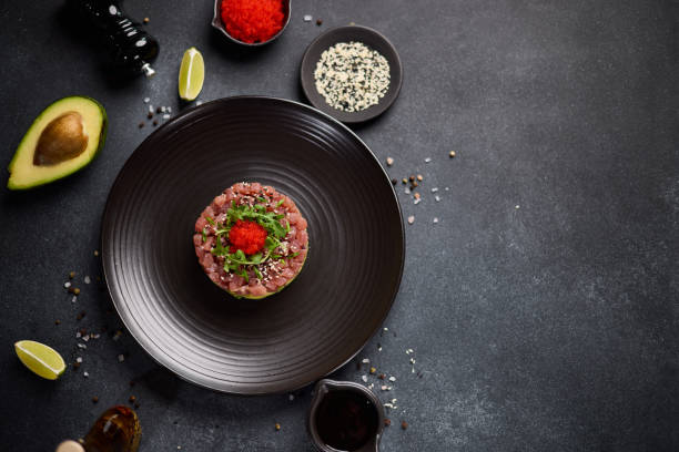 istock Tuna and avocado tartare on a dark ceramic plate 2152976982