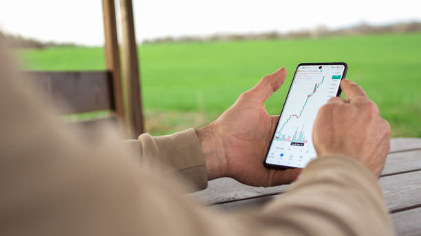 Man checking on trading positions and stock markets on TradingView app.