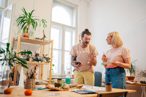 istock Happy couple painting and chatting at creative art studio. 2152977280