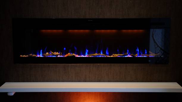 istock view on electric fireplace with artificial sparkling flame, decor for the interior, blue flame on crystals 2152977517