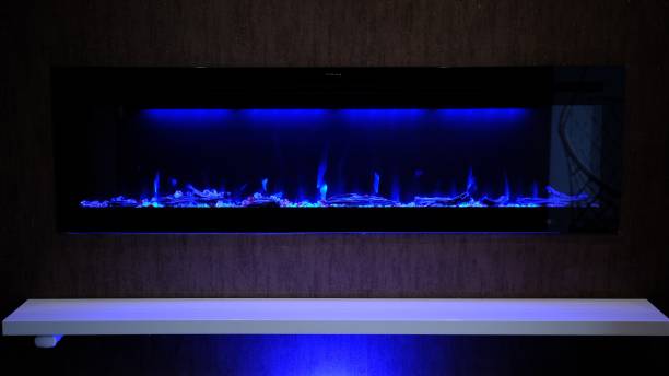 istock view on electric fireplace with artificial sparkling flame, decor for the interior, blue flame on crystals 2152977674