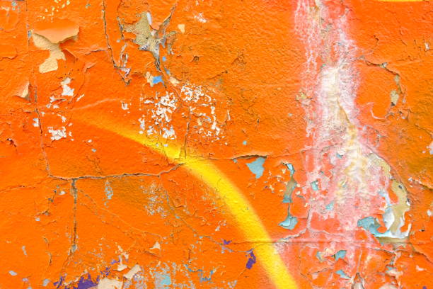 istock Colorful wall background with damaged paints of orange 2152977697