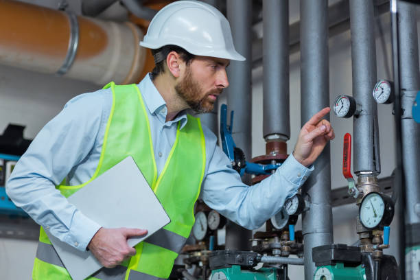istock Portrait of young engineer taking notes at control room in factory 2152978005