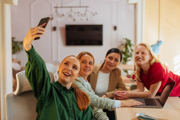 istock Four female workers taking a selfie together 2152978511