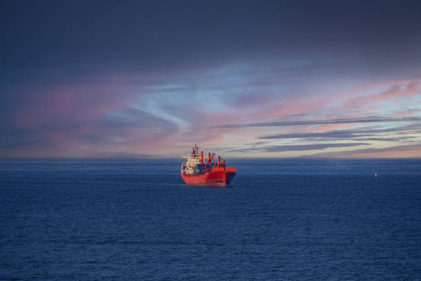 Industrial cargo ship on the horizon