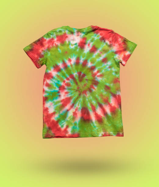 istock A green and red tie dye T-shirt on an abstract background. 2152989855