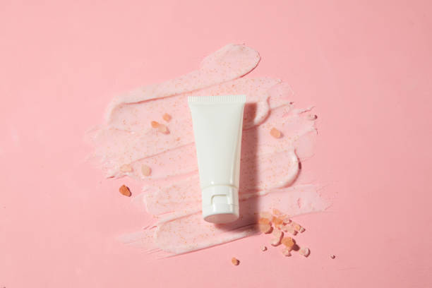 istock Advertising template for exfoliation product has himalayan pink salt origin with a blank label tube in white color for adding brand packaging. Blank space for design, high angle shot 2152993355