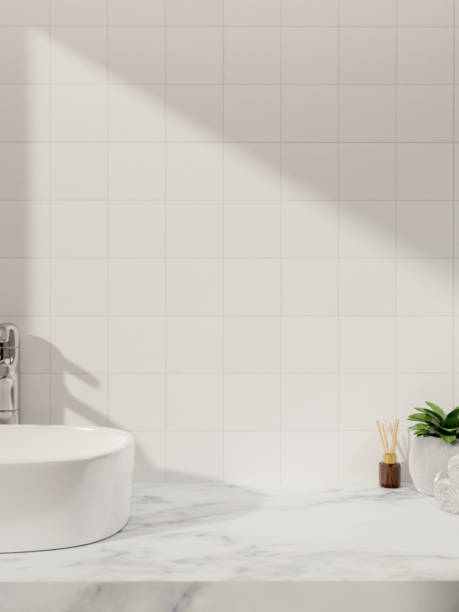 istock A luxurious white marble bathroom vanity countertop against the white tile wall with daylight shadow 2152993416