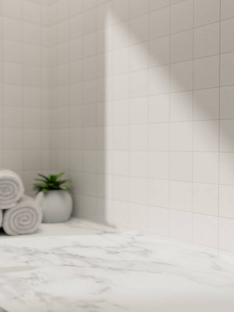 istock A space for showcasing products on a white marble bathroom tabletop against the white tile wall. 2152993419