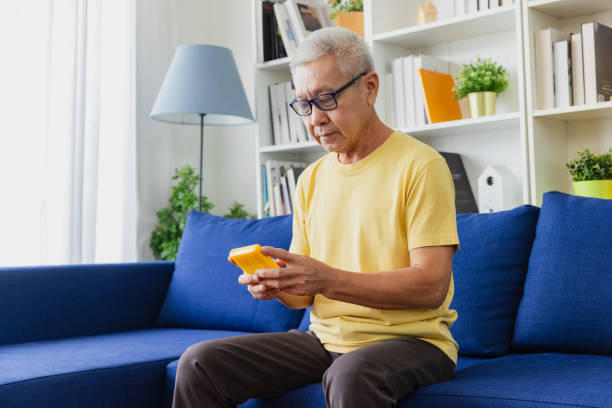 istock Hobbies at home, senior man playing games. 2152997590