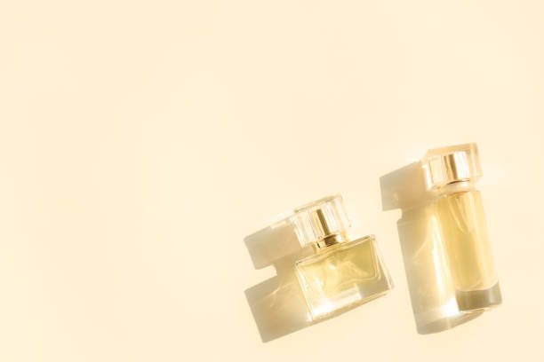 istock Perfume bottle on beige background, Glass bottle of perfumery 2153000656